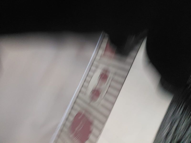 The image is too blurry and obstructed to identify any property features or room details.