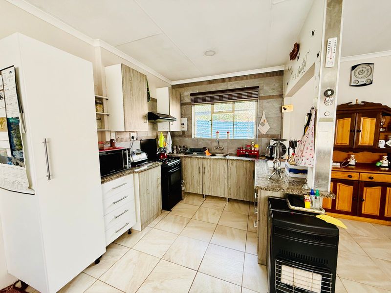 Welcoming Single Story Home with Pool and Modern Conveniences in Wolmer - Photo 8