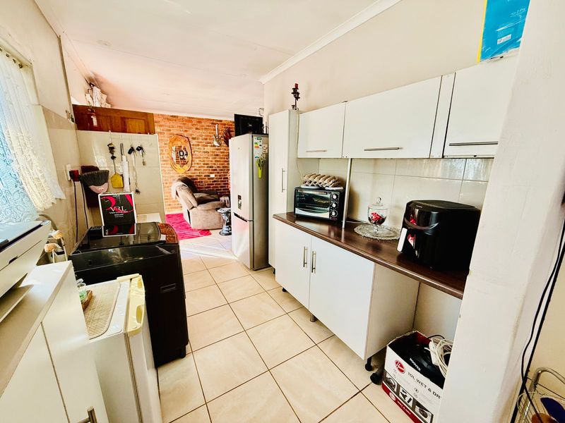 Welcoming Single Story Home with Pool and Modern Conveniences in Wolmer - Photo 6