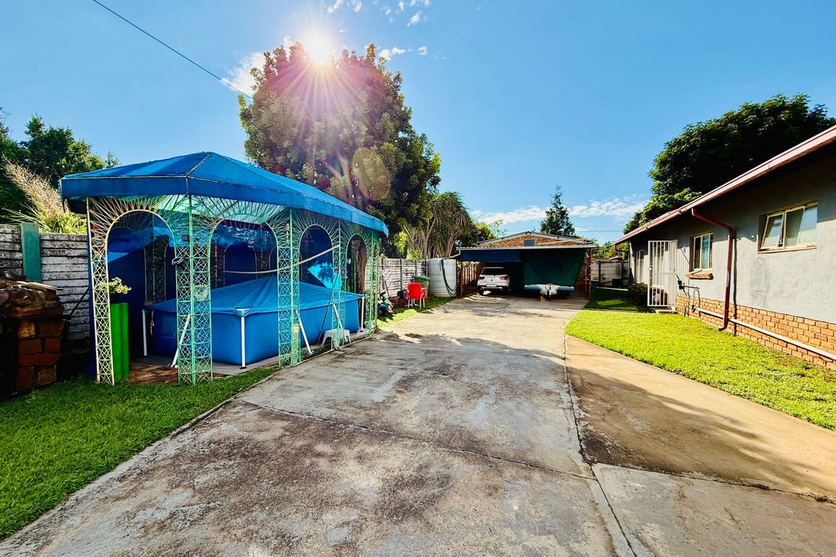 Welcoming Single Story Home with Pool and Modern Conveniences in Wolmer - Photo 2