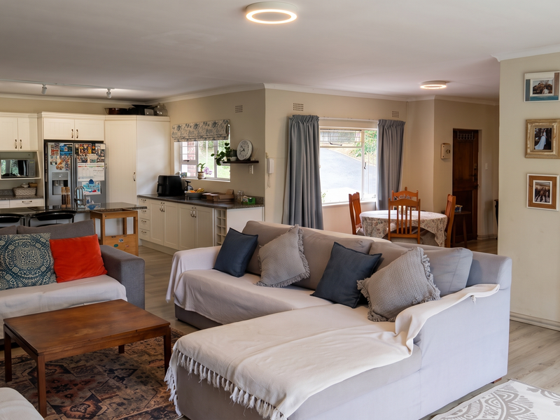 Spacious open-plan living area featuring a modern kitchen with ample cabinetry, integrated appliances, and seamless flow into the dining and lounge spaces.