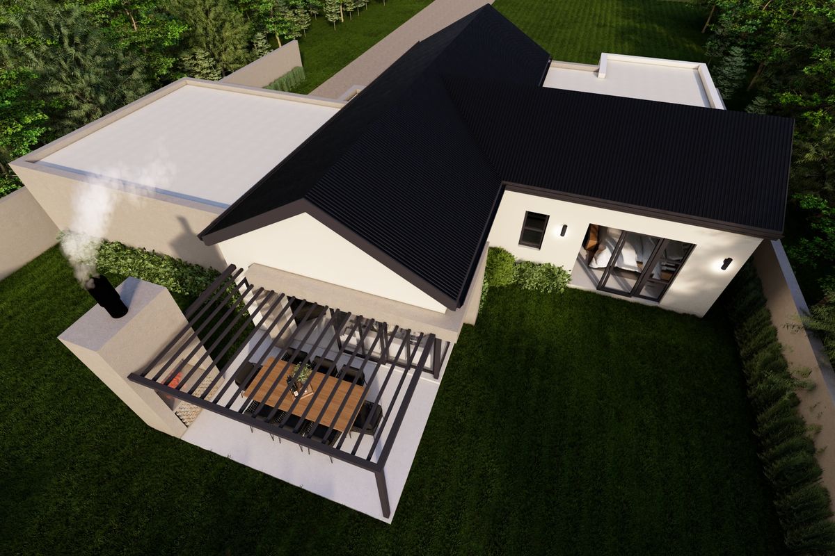 Aerial view of a modern house featuring a dark corrugated roof, a covered patio with a built-in fireplace, and a landscaped garden.