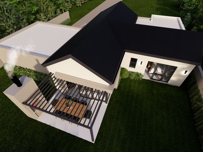 Aerial view of a modern house featuring a dark corrugated roof, a covered patio with a built-in fireplace, and a landscaped garden.