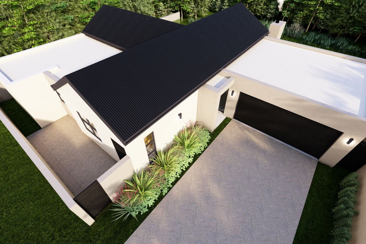 Aerial view of a modern residential property featuring a corrugated metal roof, double garage, and a paved herringbone driveway.