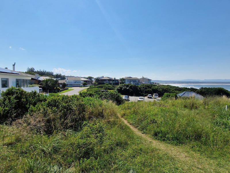A scenic view overlooking the coastal landscape and ocean from the vacant residential property.
