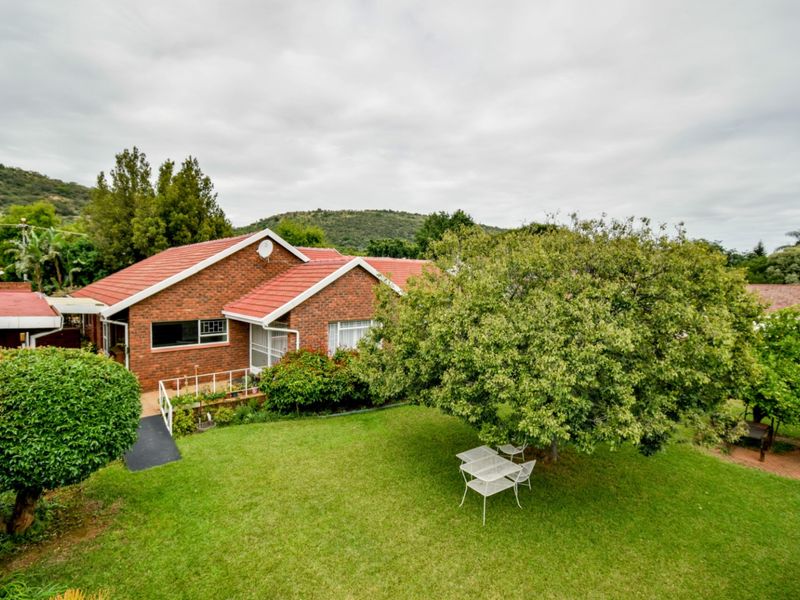 Charming Family Home with Exceptional Space and Endless Potential in Wonderboom - Photo 1