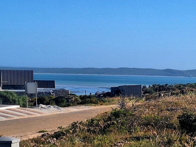 A scenic view overlooking the coastal landscape and ocean from the residential property.