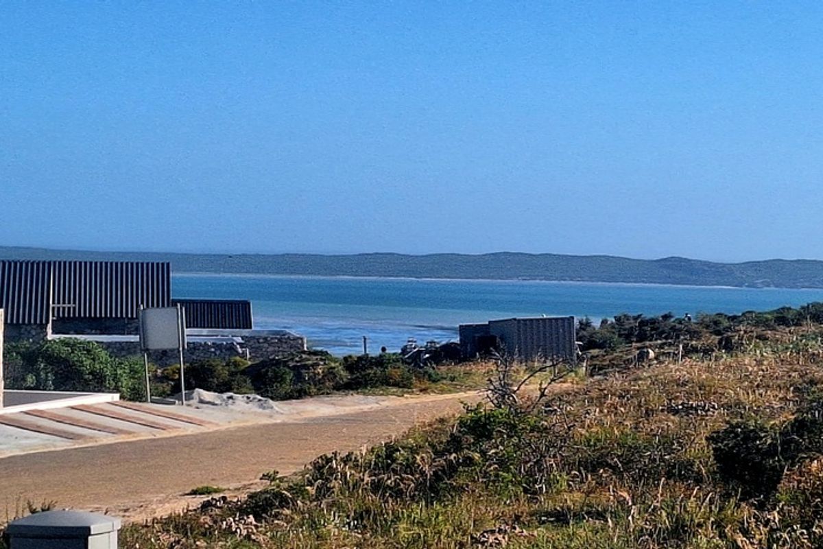 A scenic view overlooking the coastal landscape and ocean from the residential property.