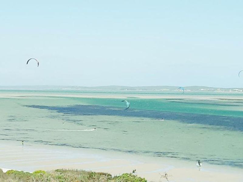 A scenic view of the lagoon and coastline, showcasing the natural landscape and water features of the property location.