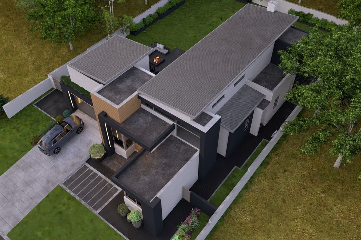 An aerial view of a modern architectural house design featuring a flat roof, clean lines, and a landscaped garden with a paved driveway.