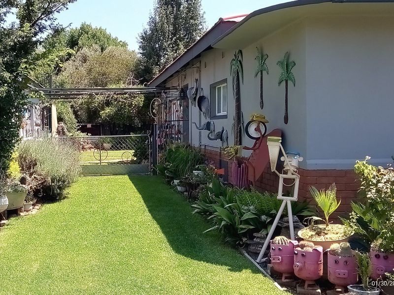 Stone’s Throw from Hennenman High | Picture-Perfect Garden & Income-Generating Flatlet - Photo 5