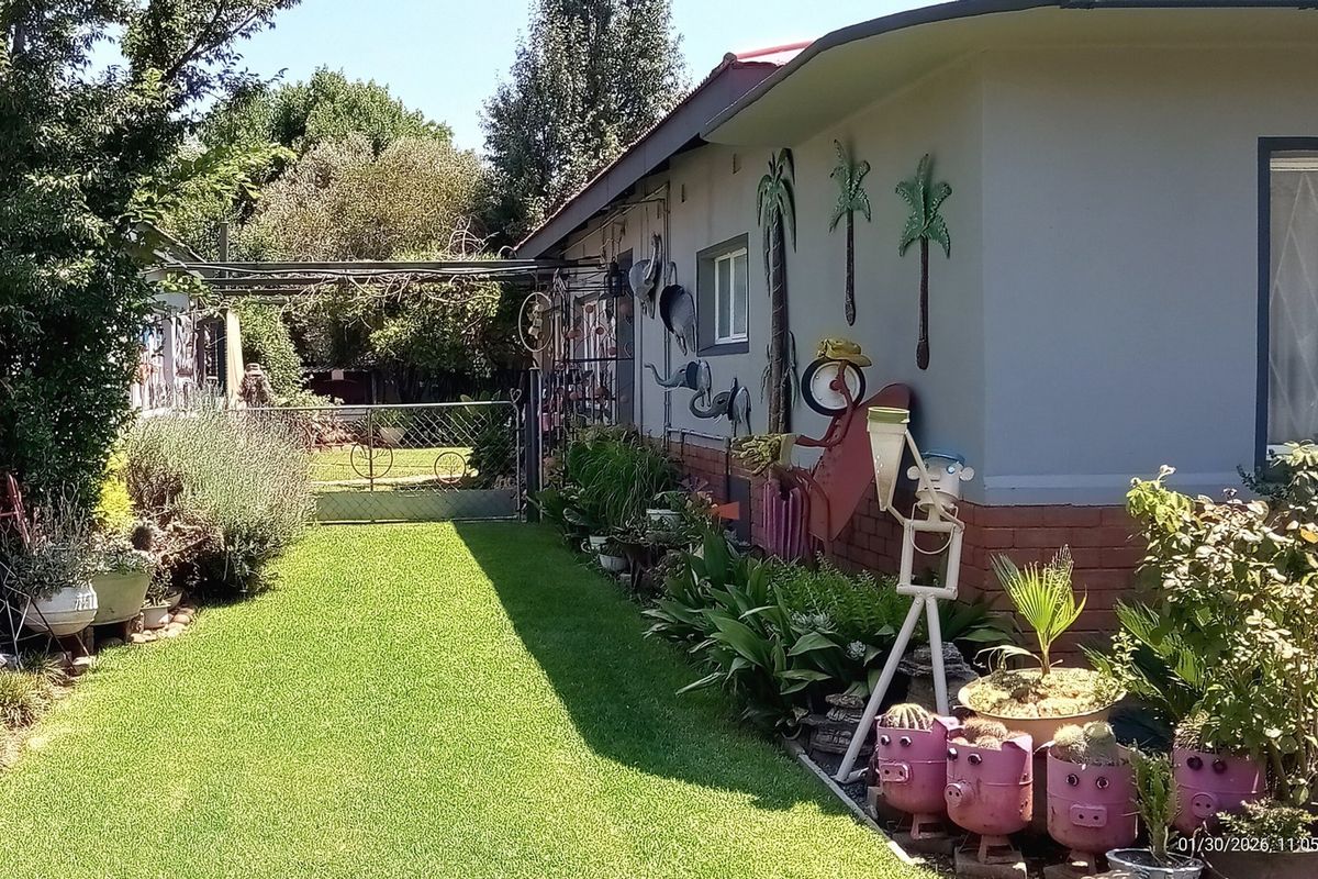 Stone’s Throw from Hennenman High | Picture-Perfect Garden & Income-Generating Flatlet - Photo 4