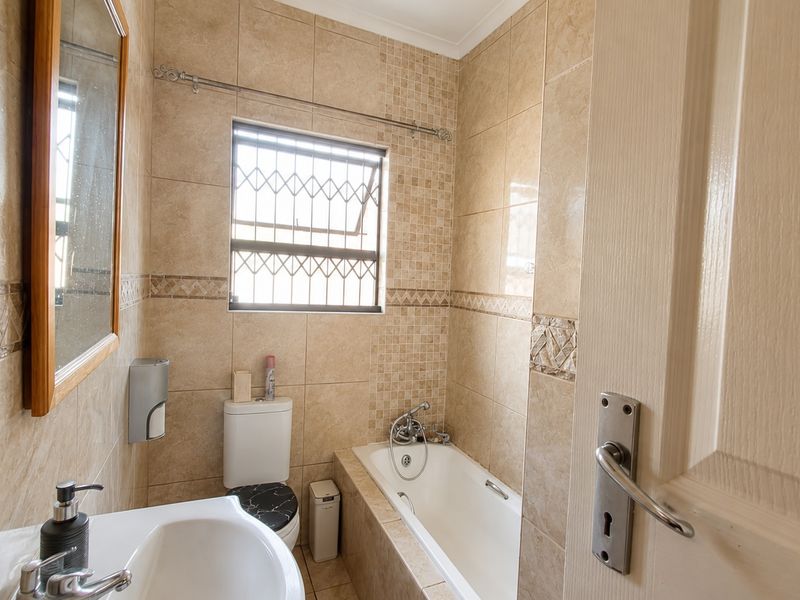 Spacious Family Home with Separate 3-Bedroom Flatlet and 4 Carports in Witpoortjie - Photo 8