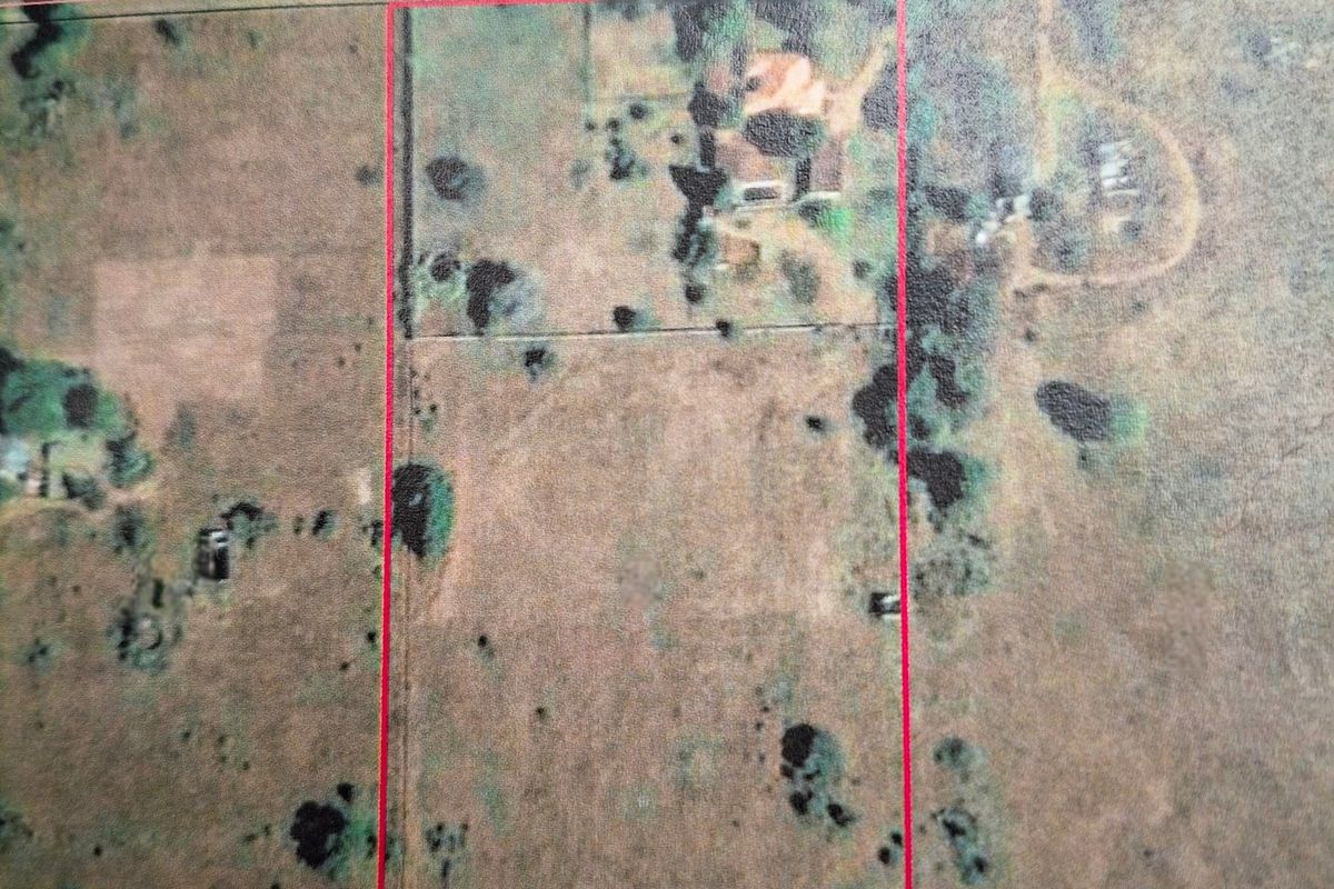 An aerial view showing the land parcel boundaries and surrounding terrain.