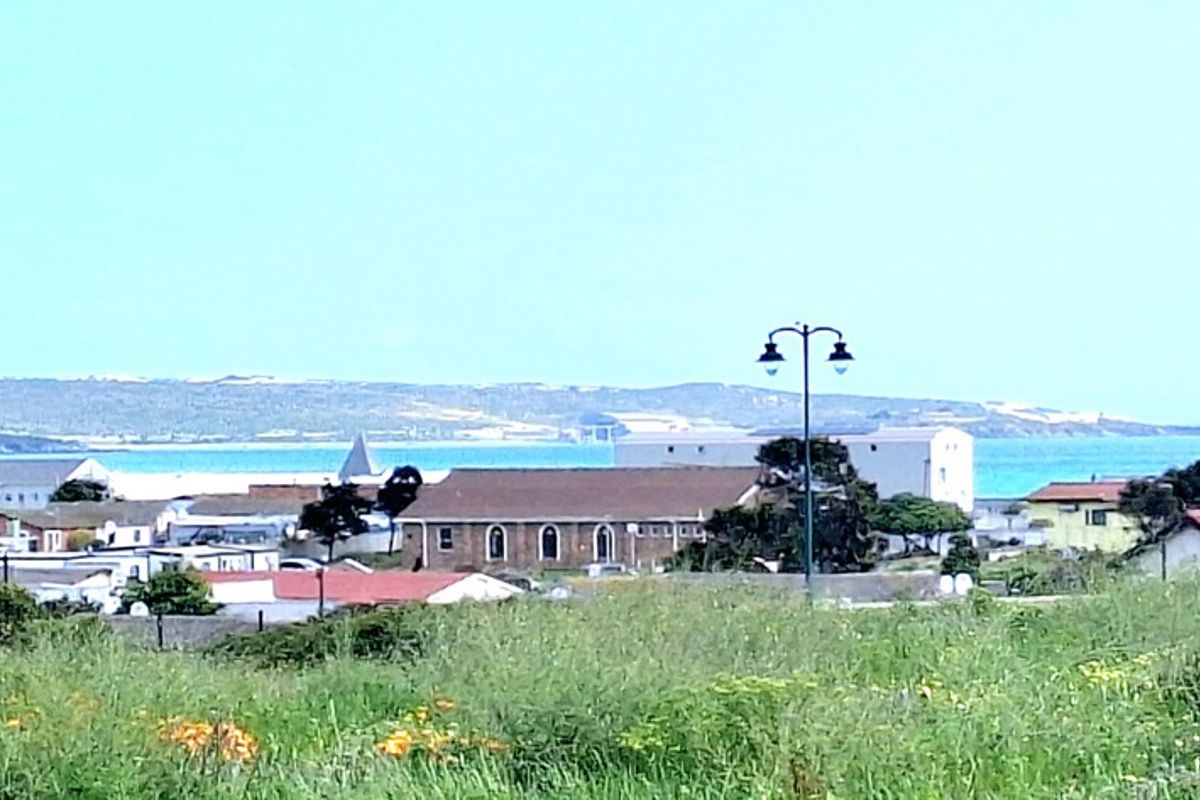 A distant view of the coastal town and ocean horizon from the property.
