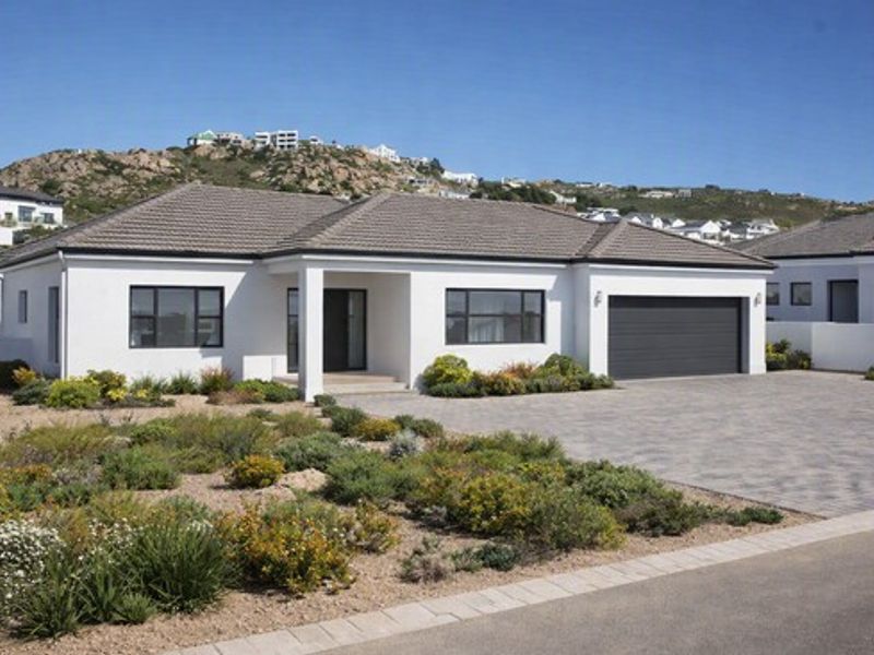 Modern single-story residential home featuring a tiled roof, paved driveway, double garage, and well-maintained landscaped garden in a quiet estate setting.