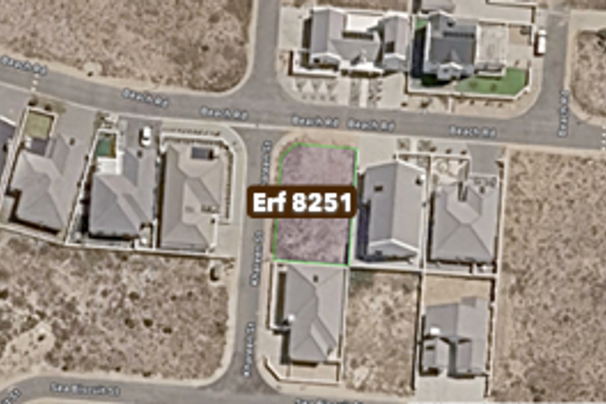 Aerial view of vacant residential plot Erf 8251 situated in a developed coastal neighborhood.