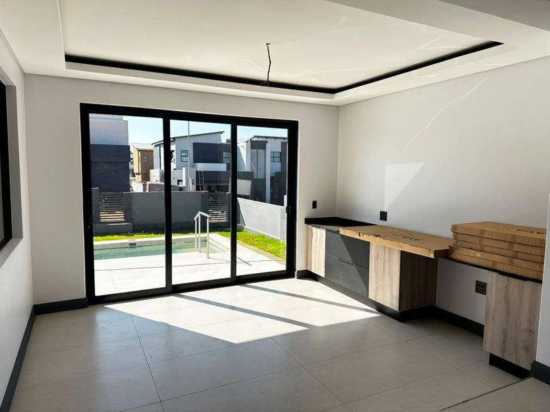 Sophisticated Family Living with Spacious Interiors and Poolside Entertainment - Photo 8