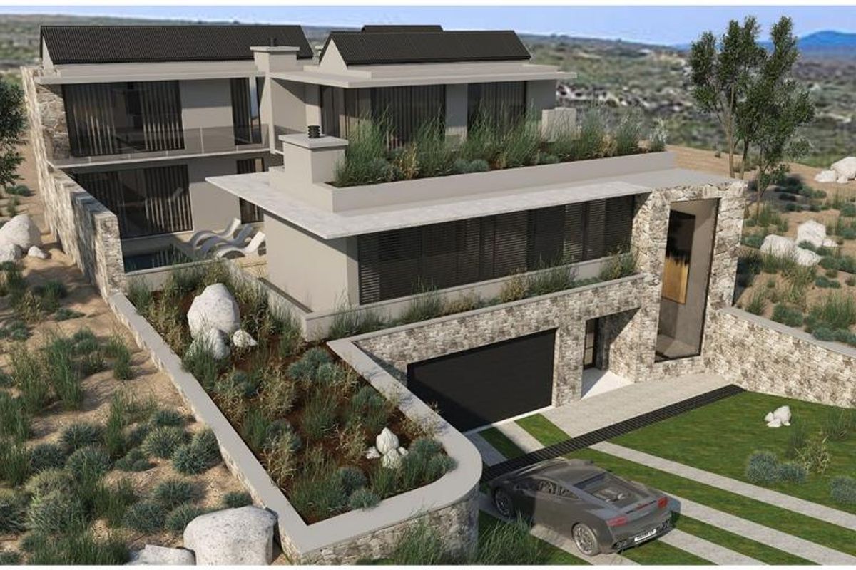 An aerial perspective of a modern architectural residence featuring stone cladding, integrated roof gardens, and a swimming pool set within a natural landscape.