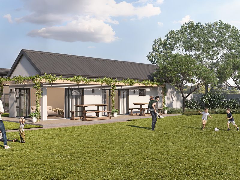 A spacious rear garden featuring a covered patio with a pergola and large sliding glass doors, perfect for outdoor living and entertaining.