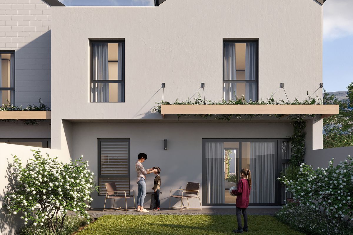Rear view of a modern townhouse featuring a private garden, covered patio with timber pergola, and large sliding glass doors for indoor-outdoor flow.