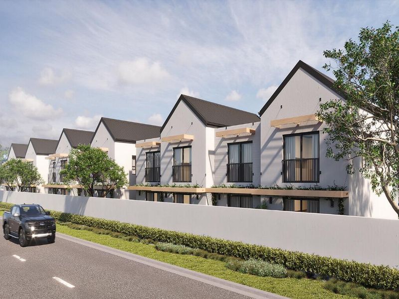 A modern townhouse development featuring pitched roofs, timber pergolas, and private balconies, enclosed by a clean perimeter wall along the street front.