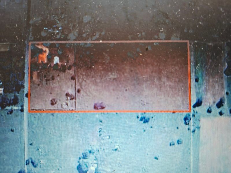 An aerial view of a vacant residential land parcel, showing the property boundaries and surrounding landscape.