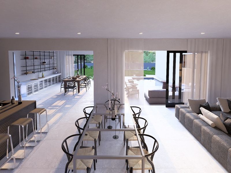 Spacious open-plan living, dining, and kitchen area featuring modern finishes, recessed lighting, and seamless indoor-outdoor flow through large sliding glass doors.