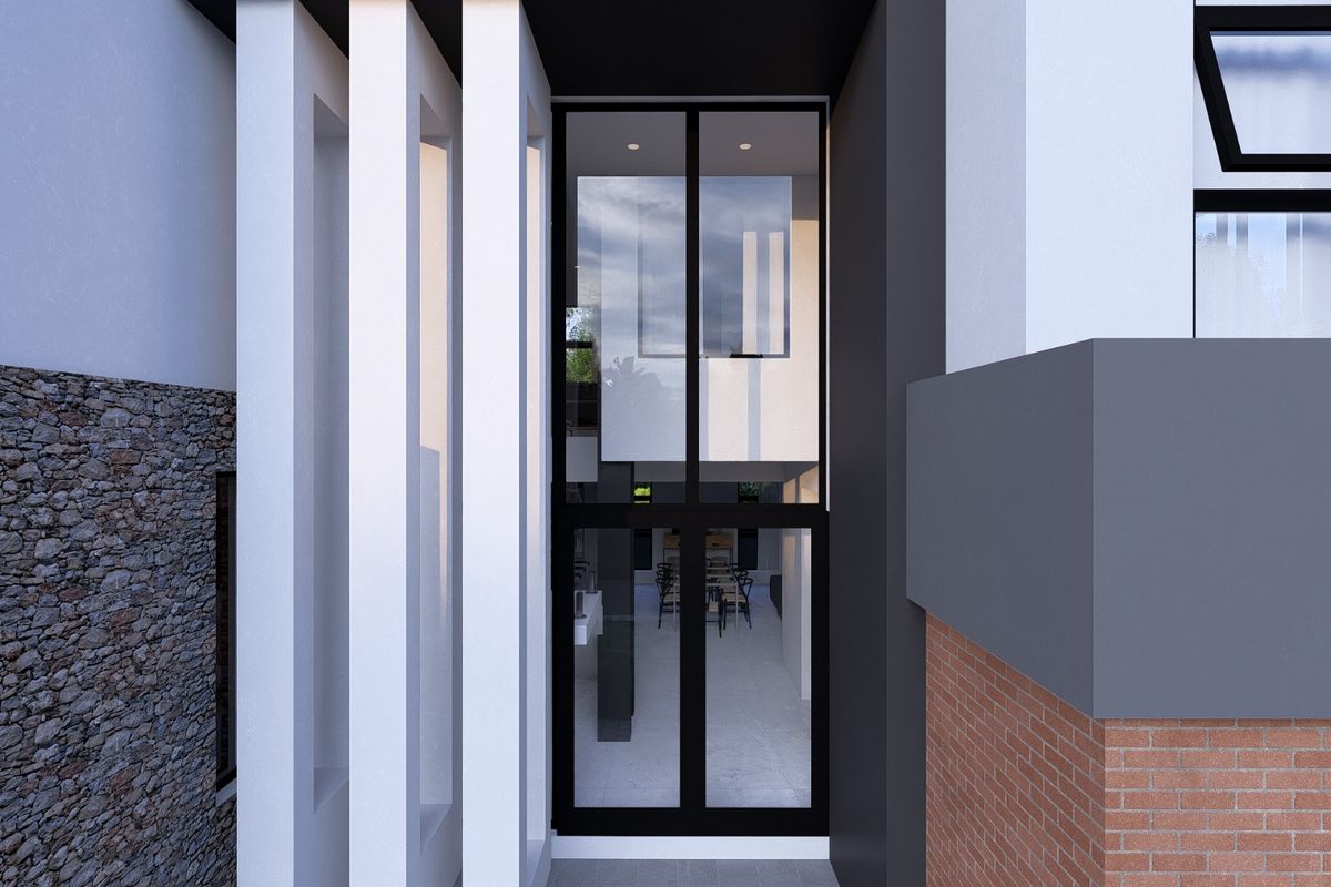 Modern entrance featuring a striking combination of stone cladding, brickwork, and architectural pillars leading to a glass-paneled front door.