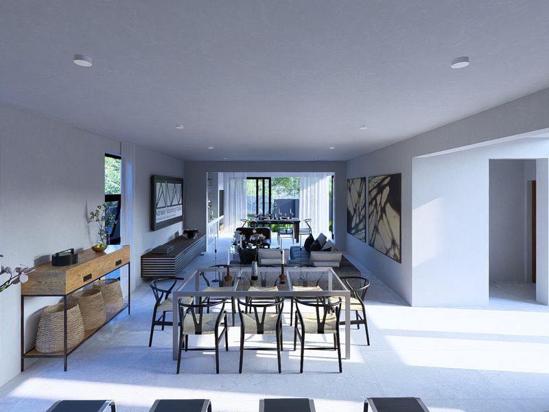Spacious open-plan living and dining area featuring modern tiled flooring, recessed lighting, and large windows providing ample natural light and garden access.