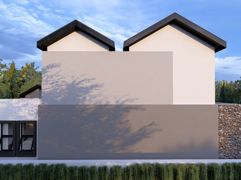 Modern architectural facade featuring clean lines, stone cladding accents, and a dual-pitched roof design.