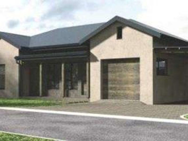 Front elevation of a modern townhouse featuring a paved driveway, integrated garage, and pitched roof design.