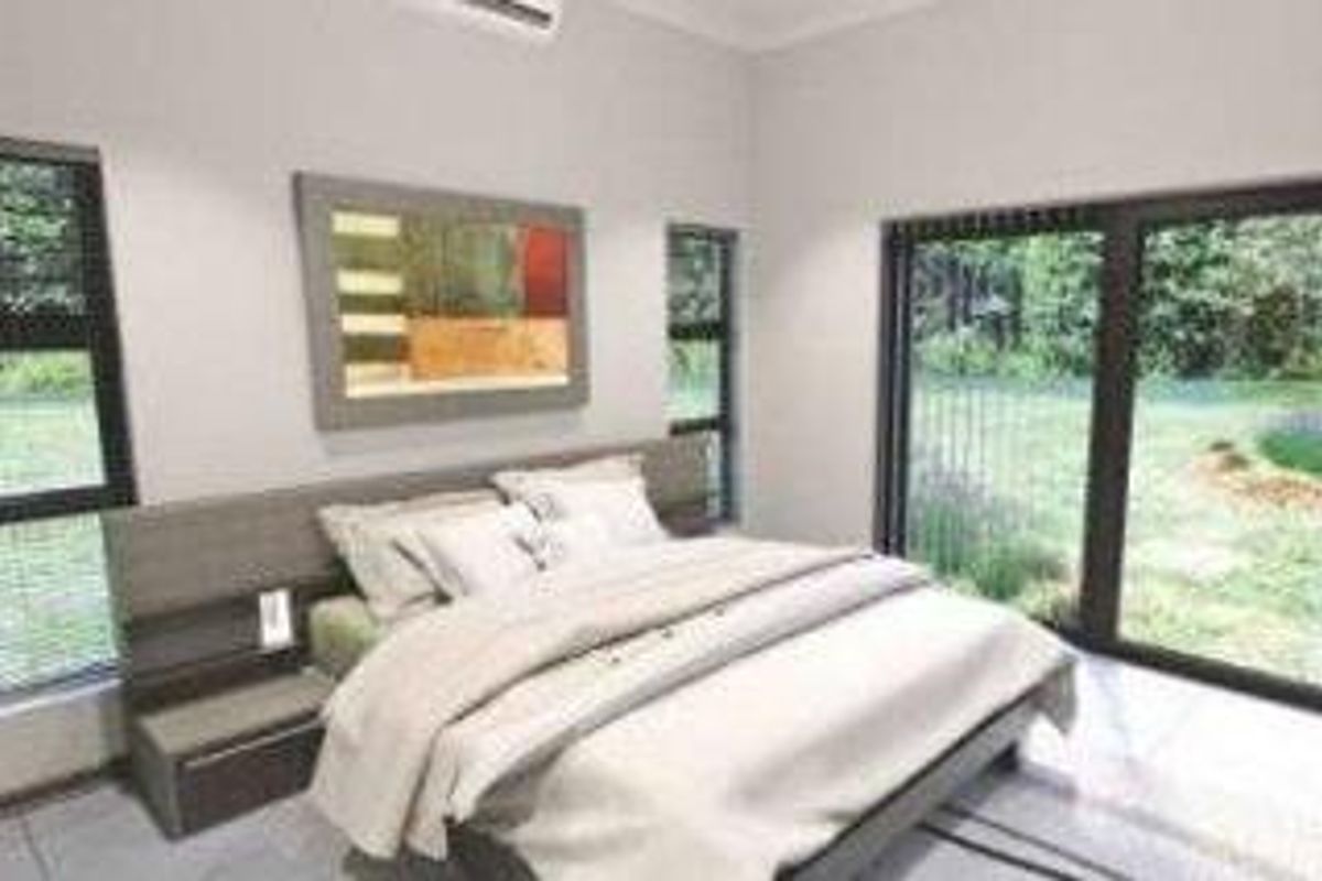A modern bedroom featuring tiled floors, split-system air conditioning, and large sliding glass doors providing direct access to the garden area.