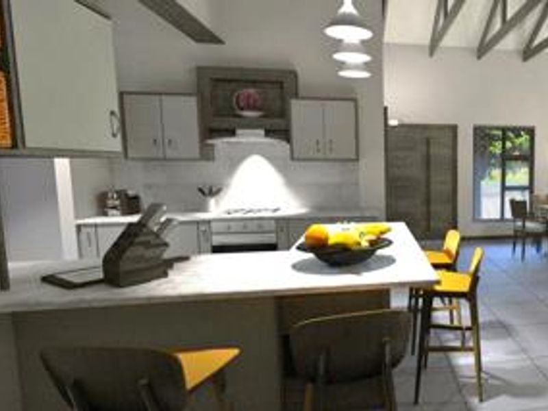 Open-plan kitchen and living area featuring a central island, modern cabinetry, built-in appliances, and high ceilings with exposed roof trusses.