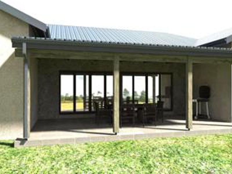 A covered outdoor patio area featuring timber support posts, a corrugated metal roof, and large sliding glass doors leading into the home.