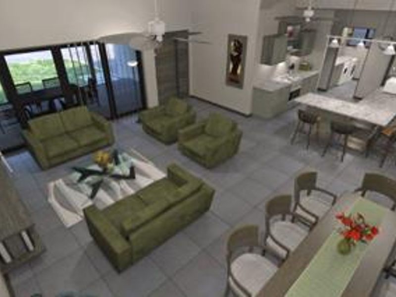 An open-plan living, dining, and kitchen area featuring tiled floors, a central kitchen island, and large sliding doors leading to an outdoor patio.