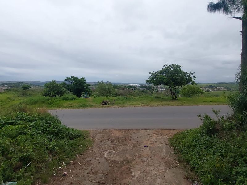 A view of the street frontage and access point for the vacant residential land, showing surrounding landscape and road infrastructure.