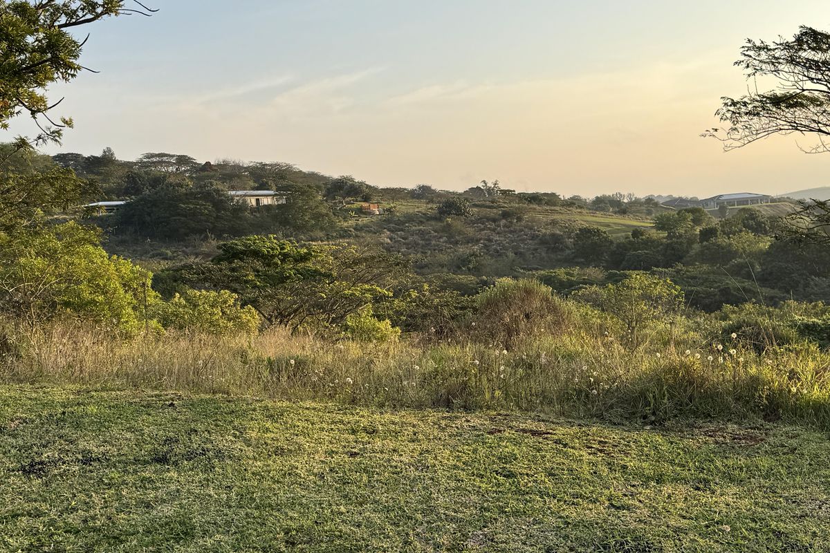 A scenic view of the surrounding landscape and rolling hills from the vacant residential land.