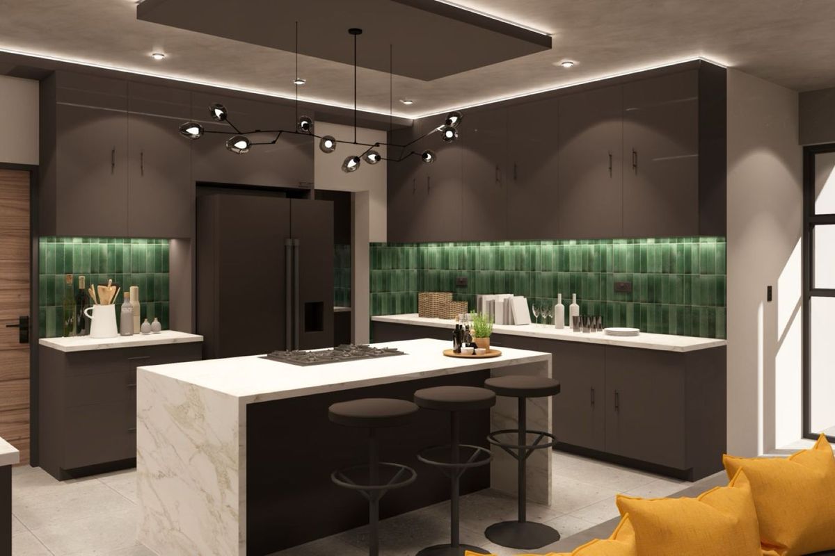 Modern kitchen featuring dark cabinetry, a marble-topped island with integrated cooktop, green tiled backsplash, and sophisticated recessed and pendant lighting.