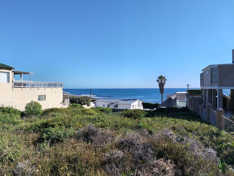 A scenic view overlooking the coastal landscape and ocean from the vacant residential property.