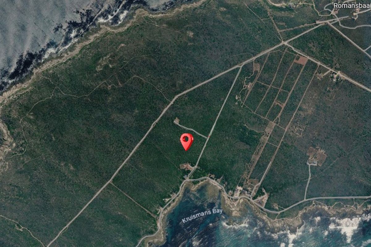 An aerial view showing the location of the vacant residential land parcel situated near the coastline.