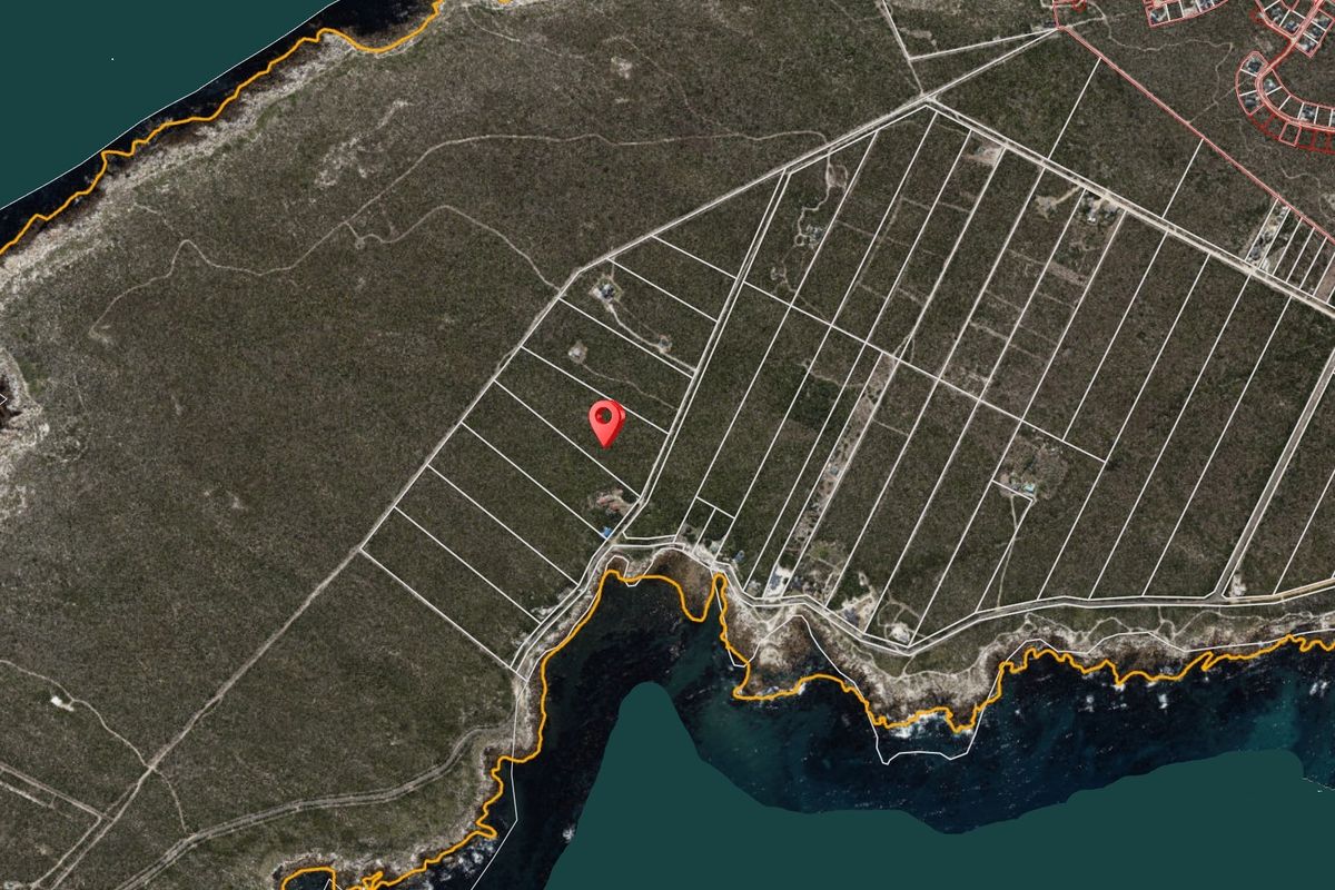An aerial satellite view showing the layout of coastal residential land parcels and their proximity to the shoreline.