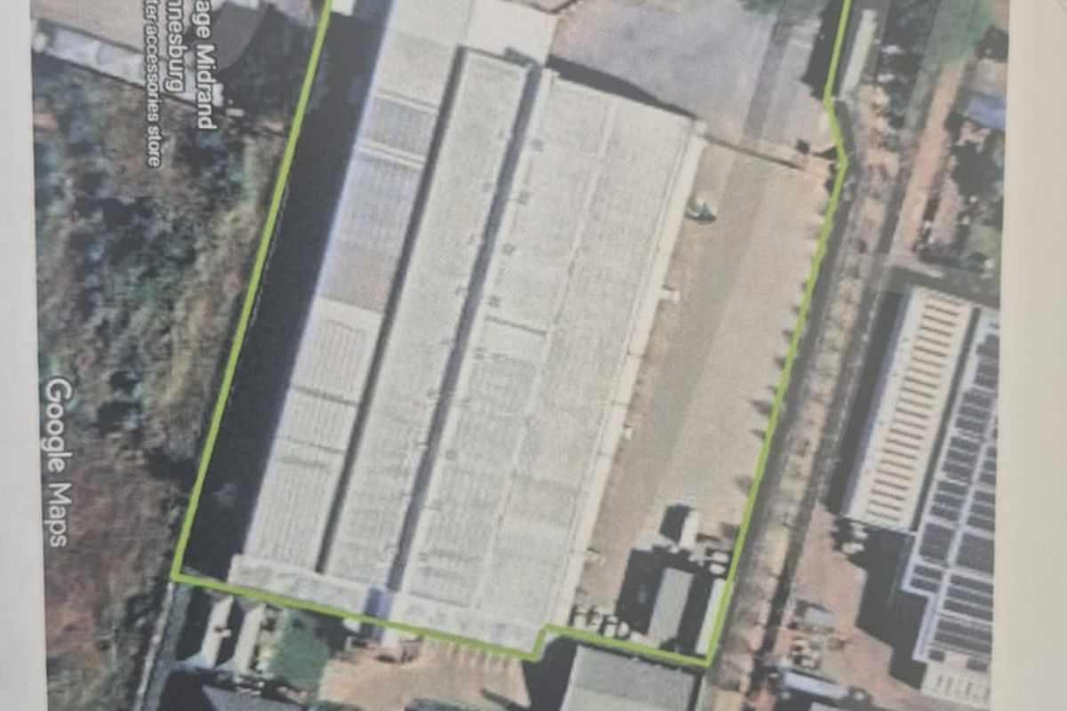 Aerial view of the industrial property site, highlighting the warehouse building, yard space, and surrounding access roads.