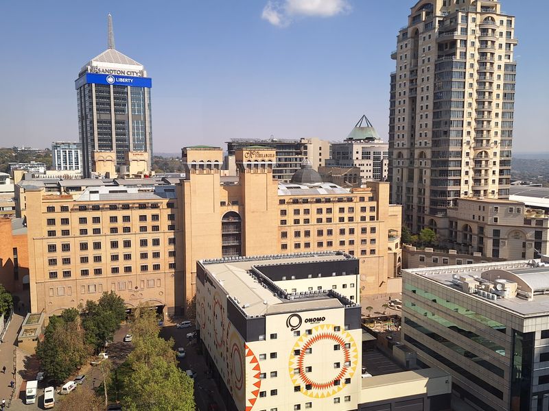Elevated city skyline view overlooking surrounding commercial buildings and urban infrastructure in Sandton.