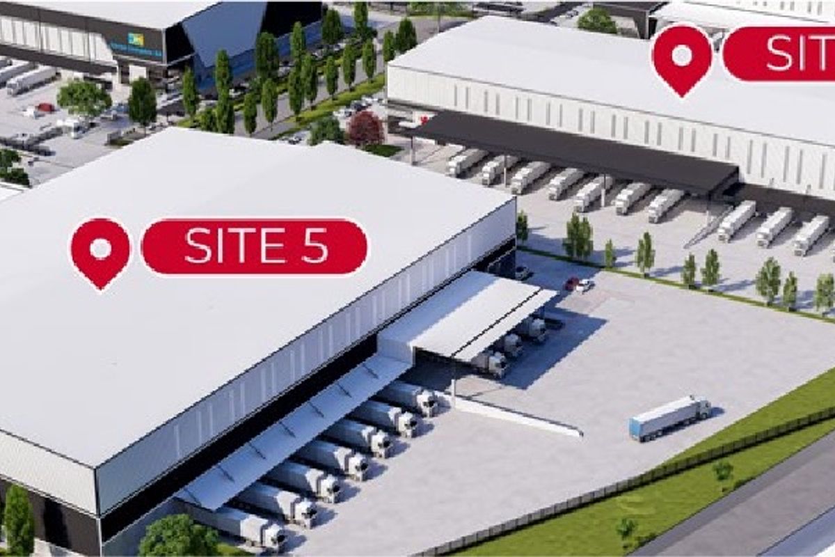 Aerial view of an industrial logistics park featuring large warehouse facilities with multiple loading docks and extensive truck maneuvering areas.