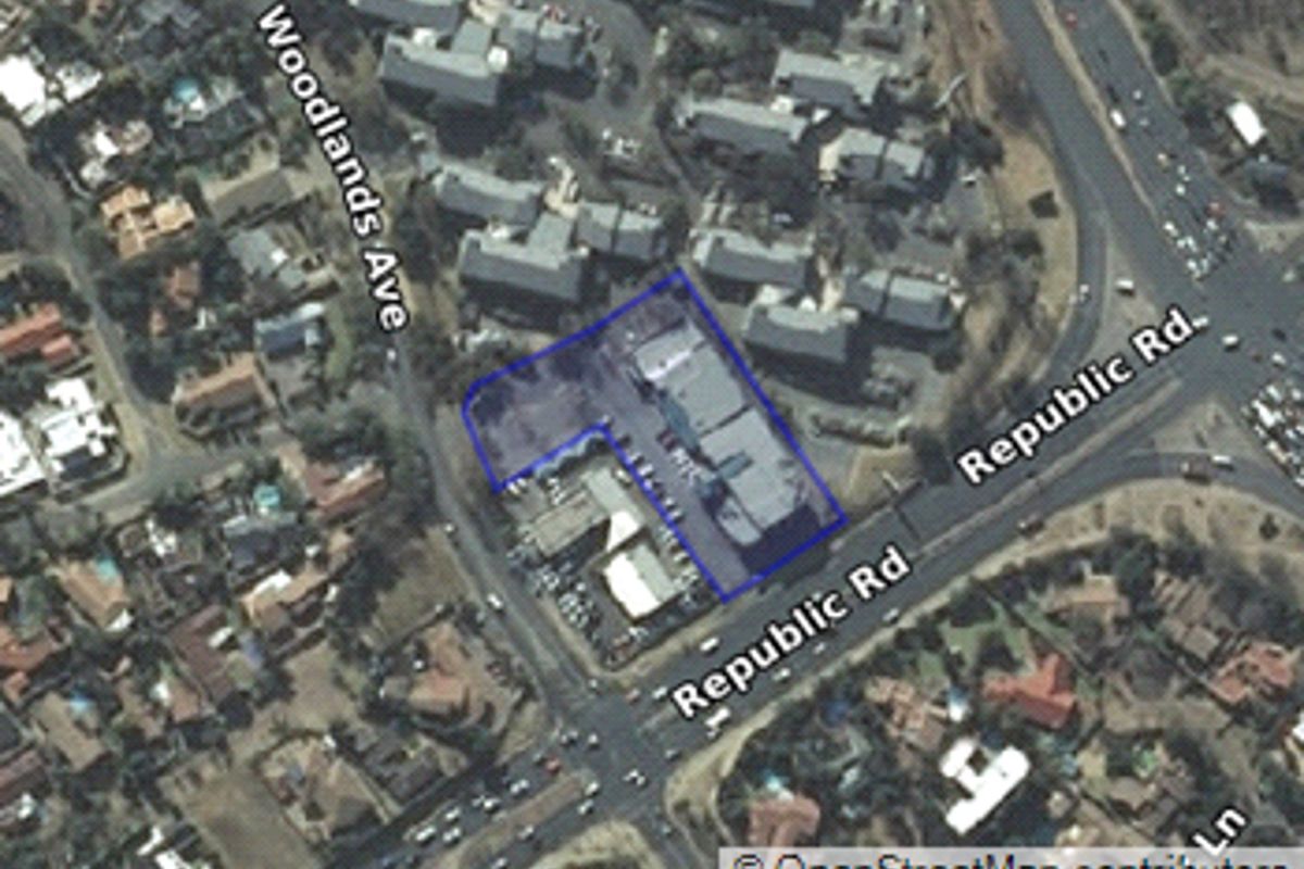 Aerial view of the retail property located at the intersection of Woodlands Avenue and Republic Road, highlighting the building footprint and surrounding street access.