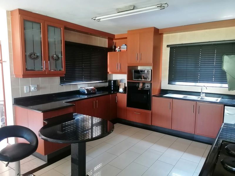 Elegant 4-Bedroom Family Home with Elevated Living in a Sought-After Location - Photo 8