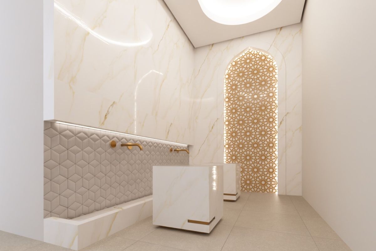 A modern, luxurious bathroom featuring marble wall cladding, geometric tile accents, gold-toned wall-mounted faucets, and an intricate decorative arched screen.