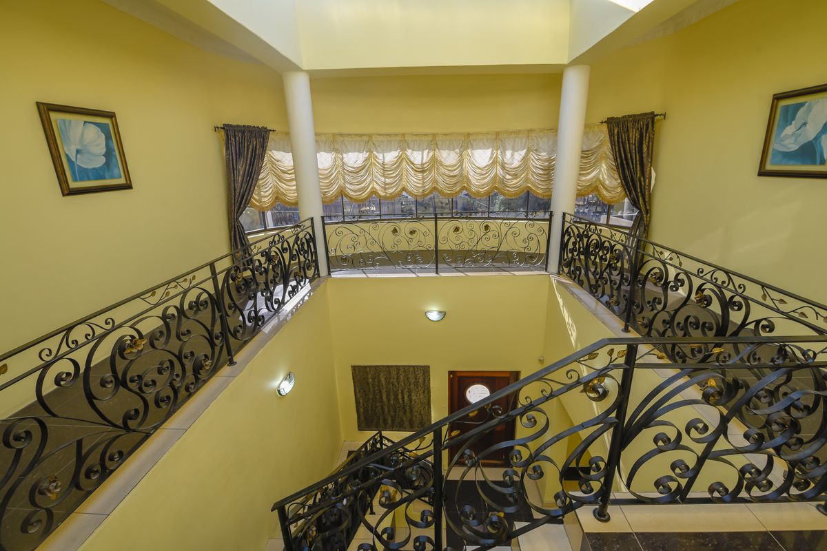 Exquisite 5-Bedroom Family Home with Premium Features - Photo 4