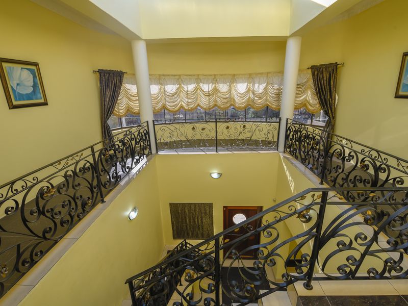 Exquisite 5-Bedroom Family Home with Premium Features - Photo 4